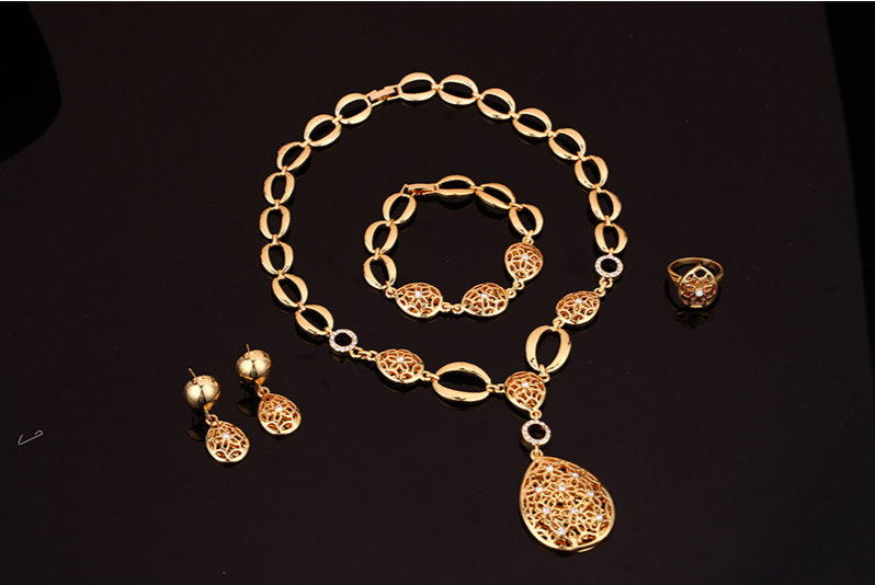 Elegant Four-Piece Jewelry Set: Necklace, Earrings, Bracelet & Ring